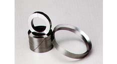 What is the thermal stability performance difference of a die-formed graphite ring compared to PTFE?